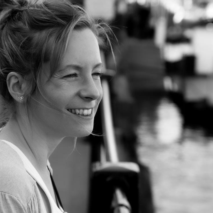 Kaveri Mehta, Lead Design Curator at Harvest Corner Hub, reviewing corporate floral arrangements